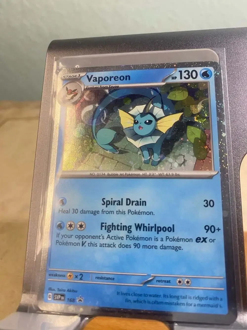 Pokemon Vaporeon 168 Holo Black Star Promo Card (swirl)